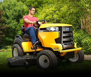 man on Cub Cadet riding lawn mower